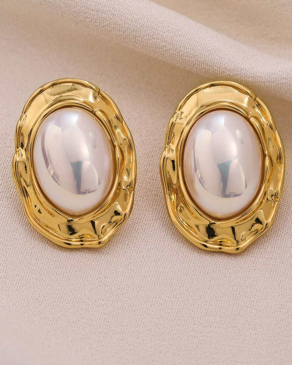 Detailed macro shot of the 18K gold plated texture surrounding the large oval Mabe pearl.