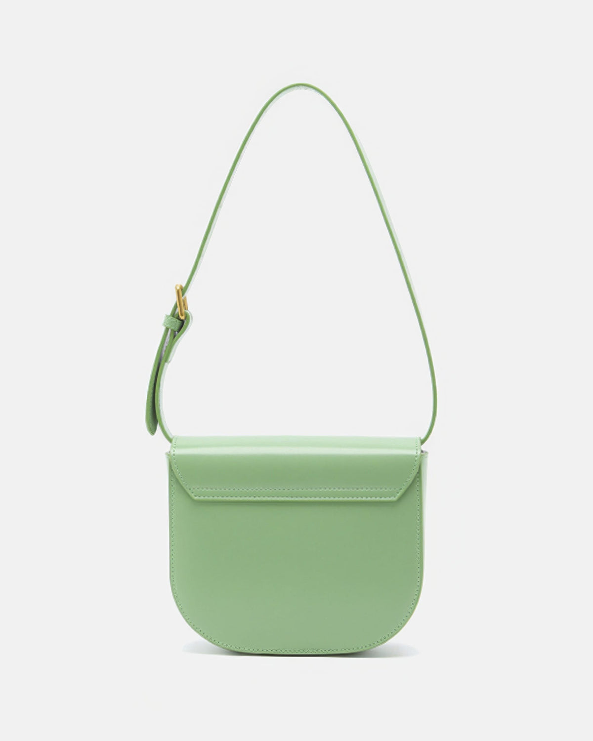 Back view of a sage green leather flap saddle handbag with a matching leather shoulder strap on a white background.