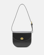 Front view of a black classic leather flap saddle crossbody bag featuring a gold turn-lock clasp.
