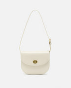 Front view of an off-white classic leather flap saddle crossbody bag with a gold turn-lock closure.