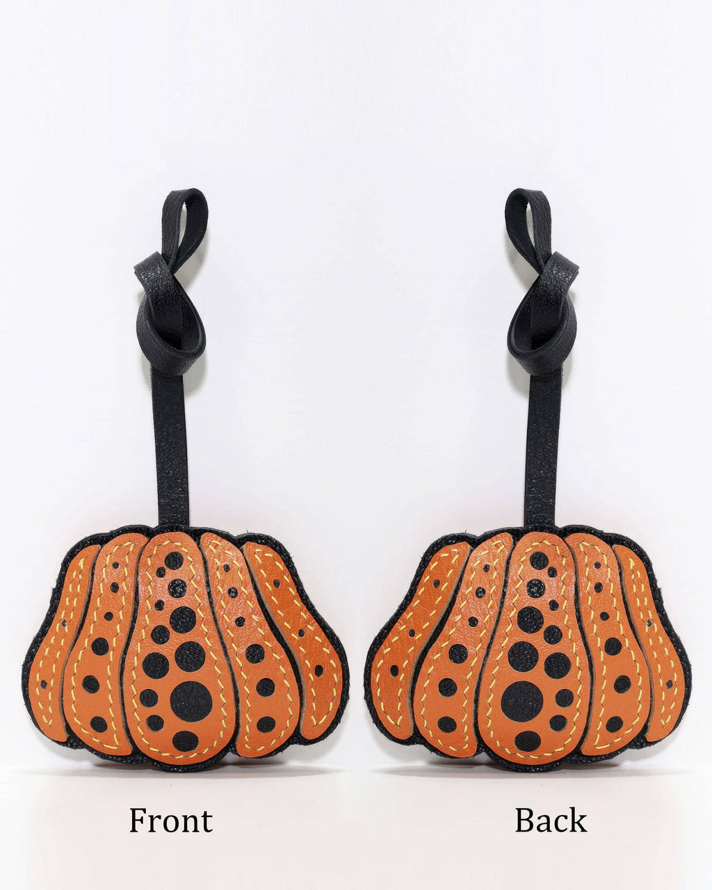 Side-by-side front and back view of orange polka dot pumpkin leather charm.