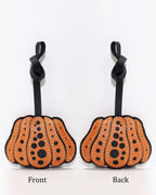 Side-by-side front and back view of orange polka dot pumpkin leather charm.