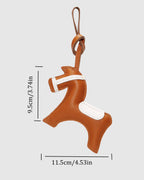 Product dimension guide for leather horse bag charm showing 9.5 cm height and 11.5 cm width measurements.