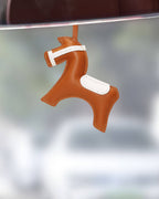 Handcrafted orange leather horse charm hanging gracefully as a car rear view mirror interior accessory.