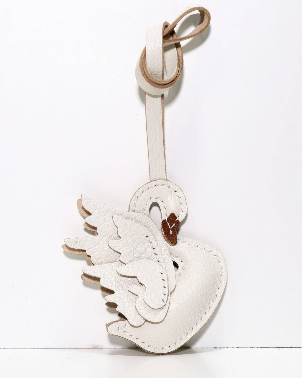 White version of graceful swan leather bag charm with brown beak detail.