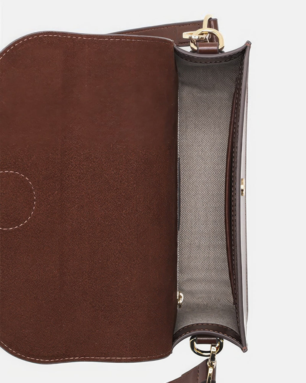 Top-down interior view of an open dark brown leather flap crossbody bag, showing the herringbone fabric lining and main compartment.