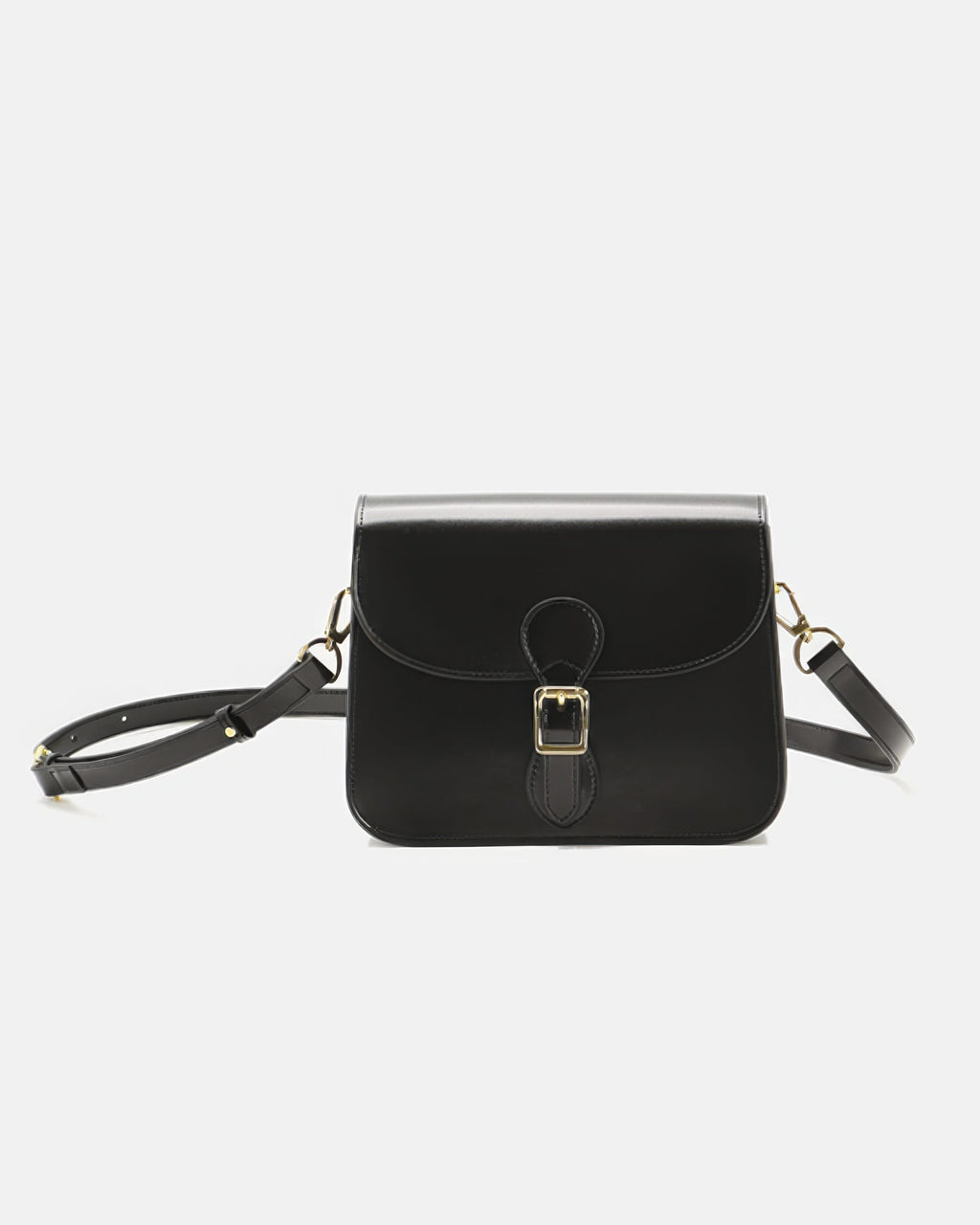 Studio product shot of a black leather flap crossbody bag with a gold buckle closure on a plain background.