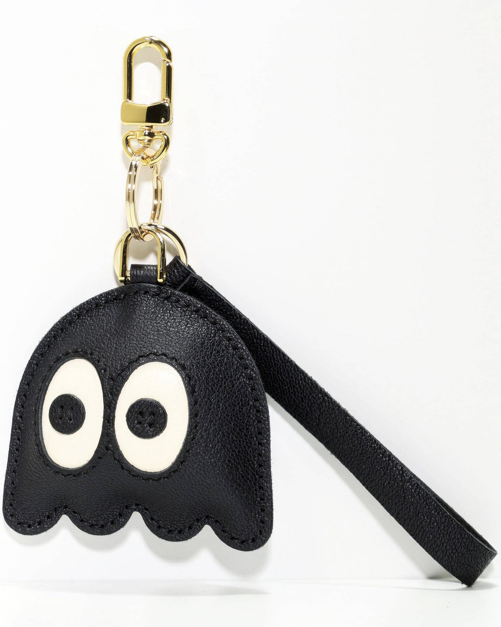 Black leather ghost charm with gold clasp and strap on a white background.
