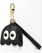 Black leather ghost charm with gold clasp and strap on a white background.