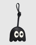Front view of playful black ghost bag charm made of French goatskin leather with knot strap.