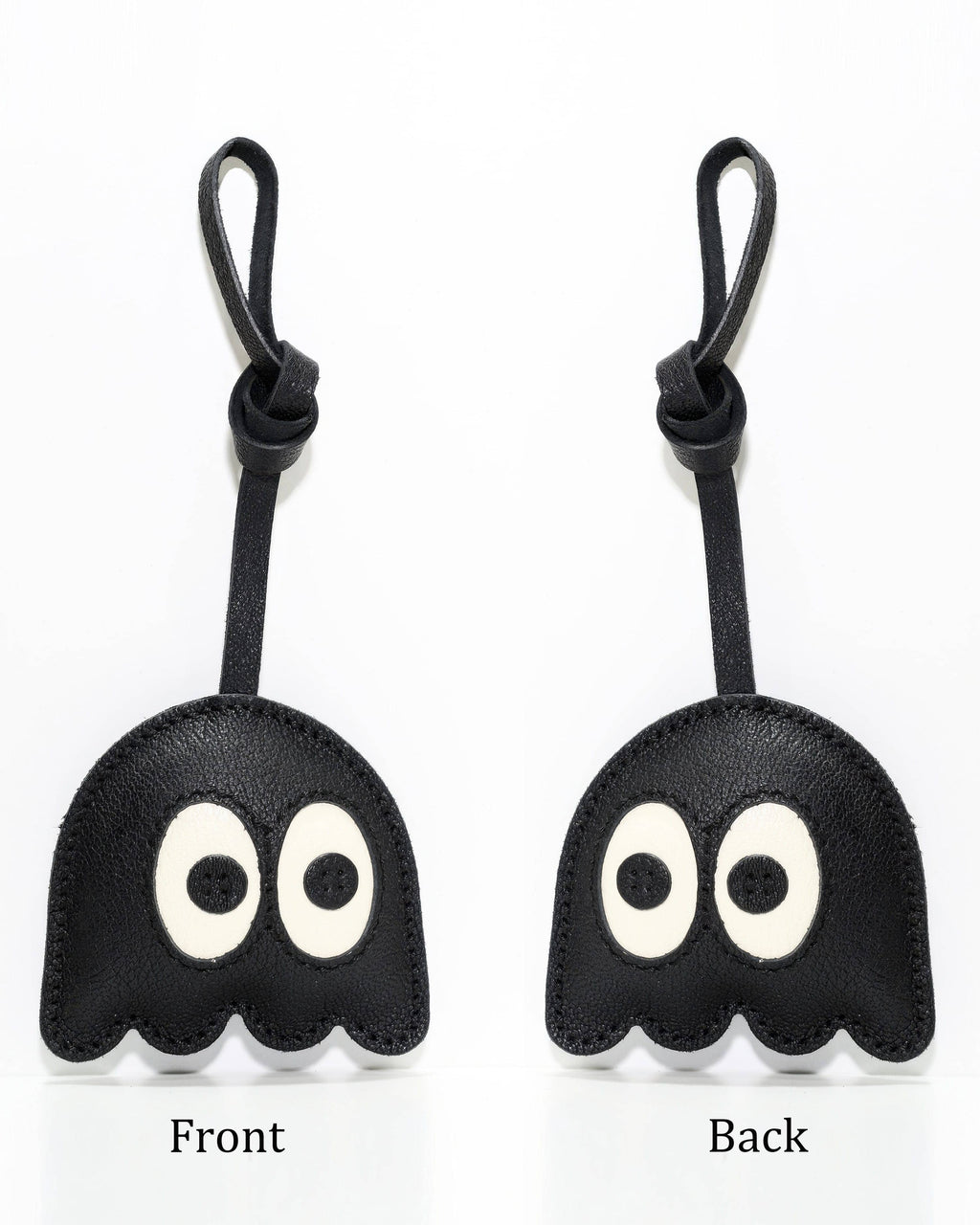 Front and back view comparison of black ghost leather bag charm accessory.