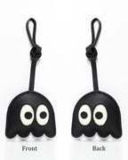 Front and back view comparison of black ghost leather bag charm accessory.