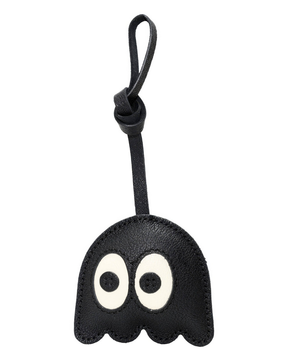 Playful black ghost leather bag charm with big cartoon eyes on plain background.
