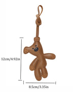 Product dimension diagram for brown leather teddy bear bag charm measuring 12 cm in height and 8.5 cm in width.