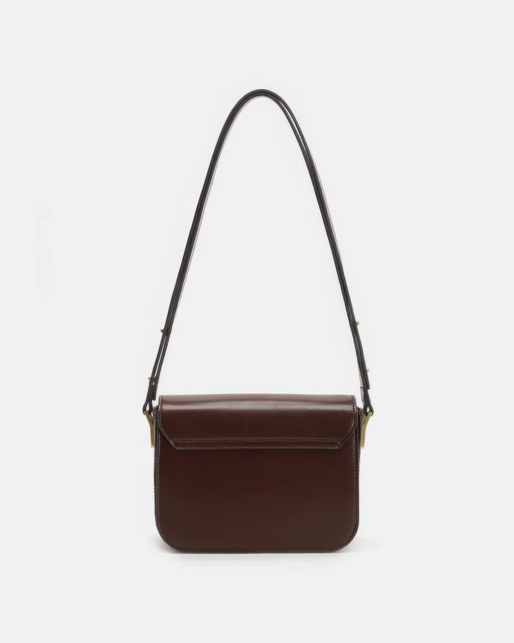 Back view of a smooth brown leather flap shoulder bag on a plain white studio background.