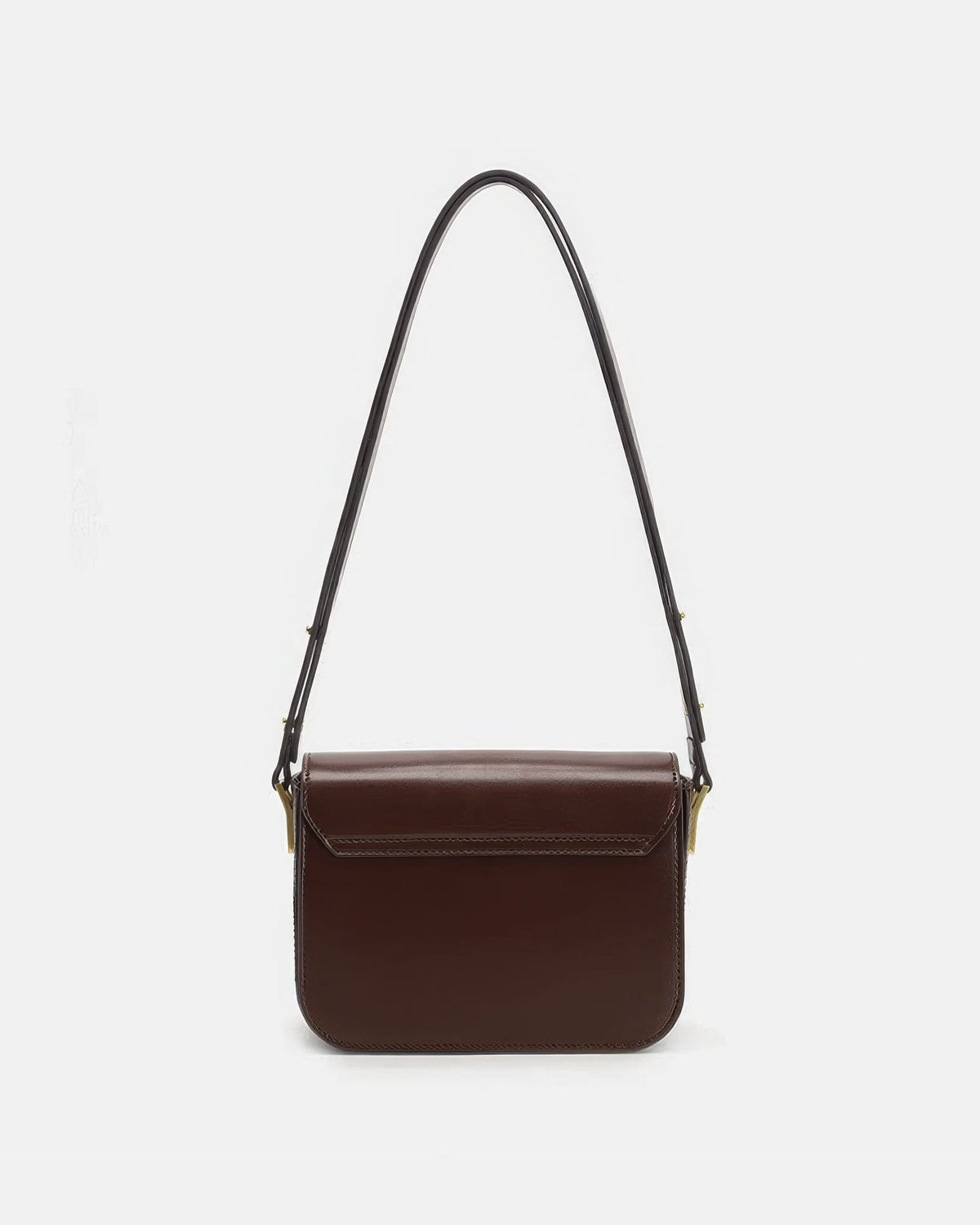 Back view of a smooth brown leather flap shoulder bag on a plain white studio background.