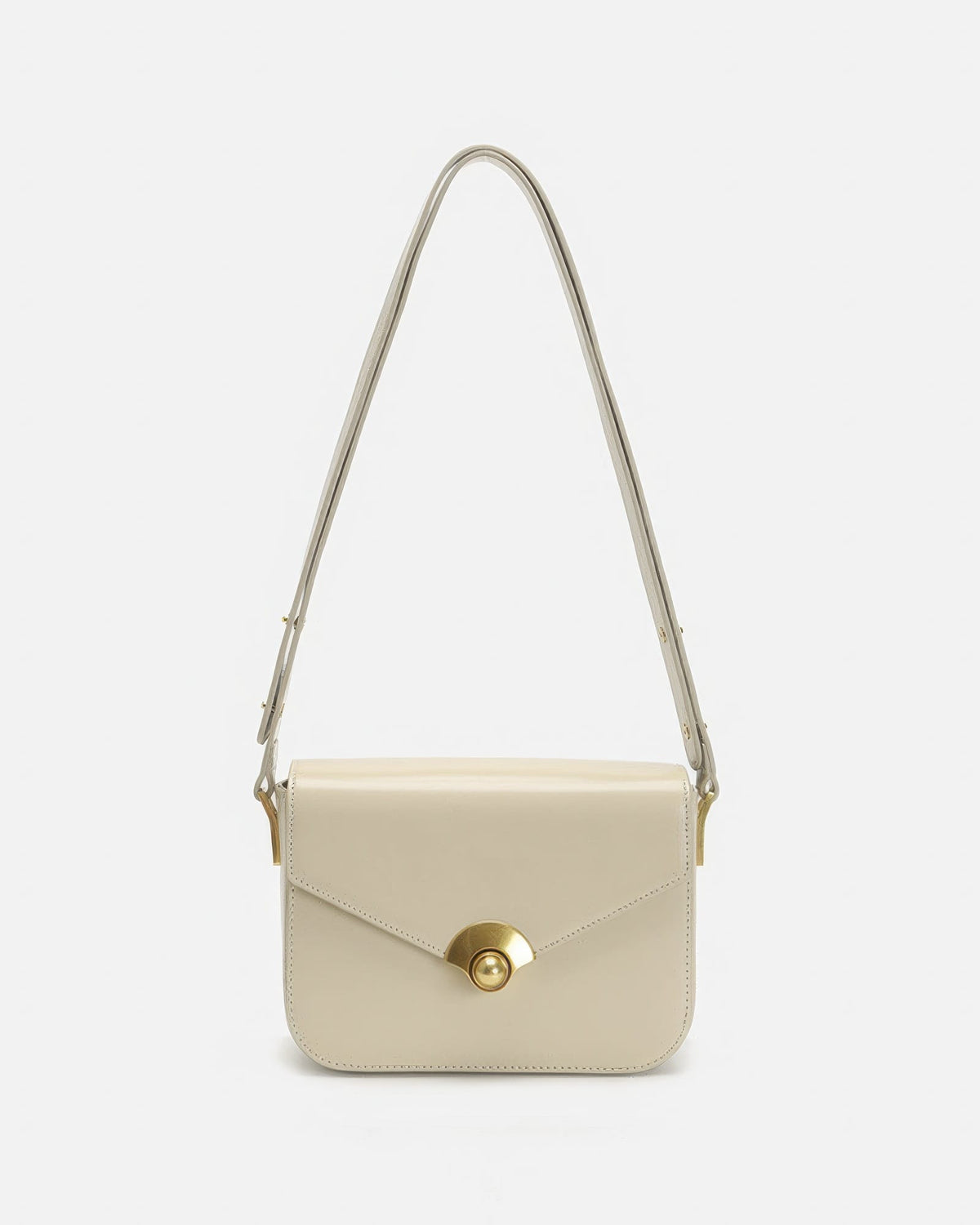 Off-white minimalist leather flap crossbody handbag with gold hardware against a clean white background.