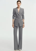 Full-length view of the grey suit with the sleeves pushed up for a more casual, modern business look.