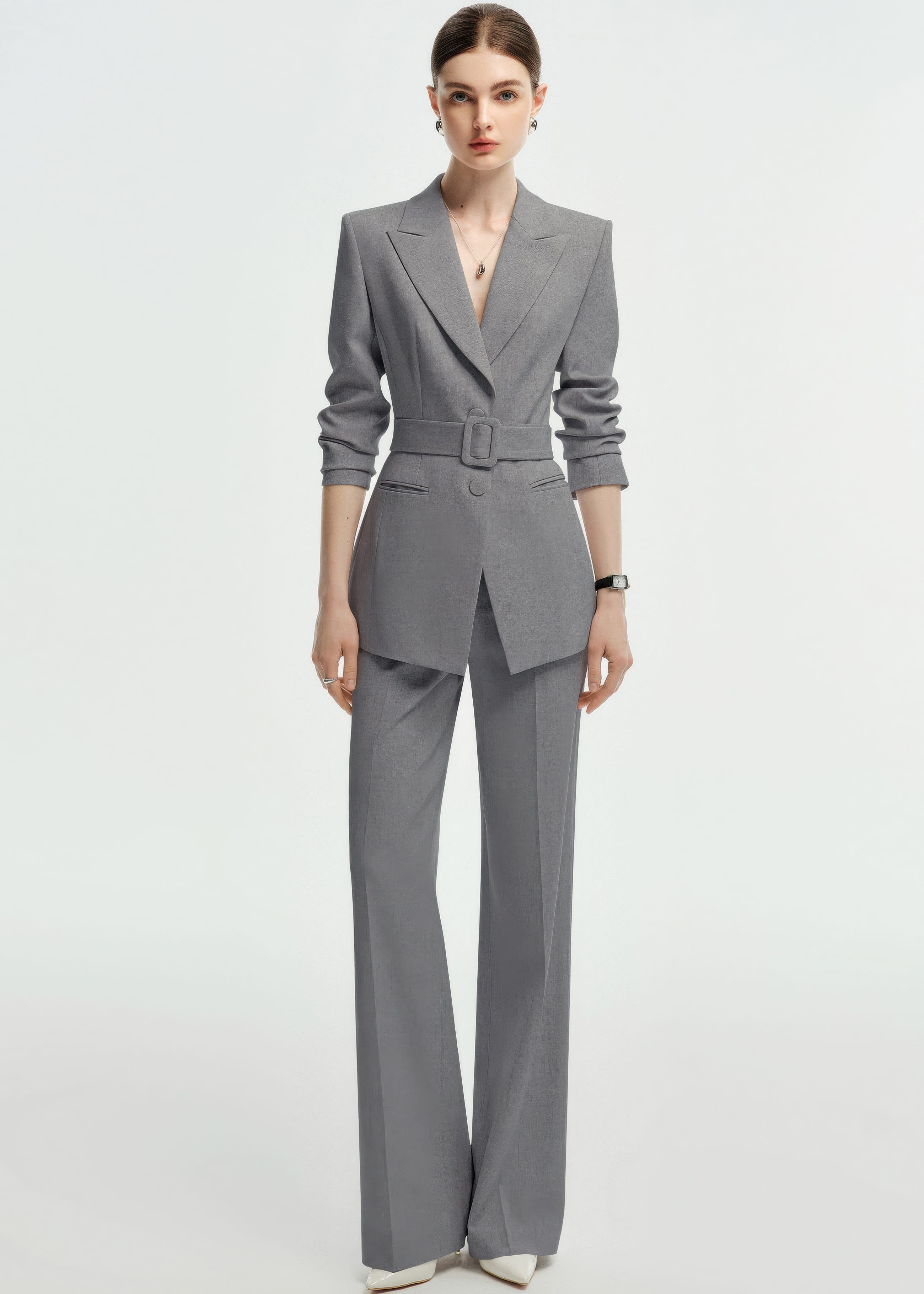 Full-length view of the grey suit with the sleeves pushed up for a more casual, modern business look.