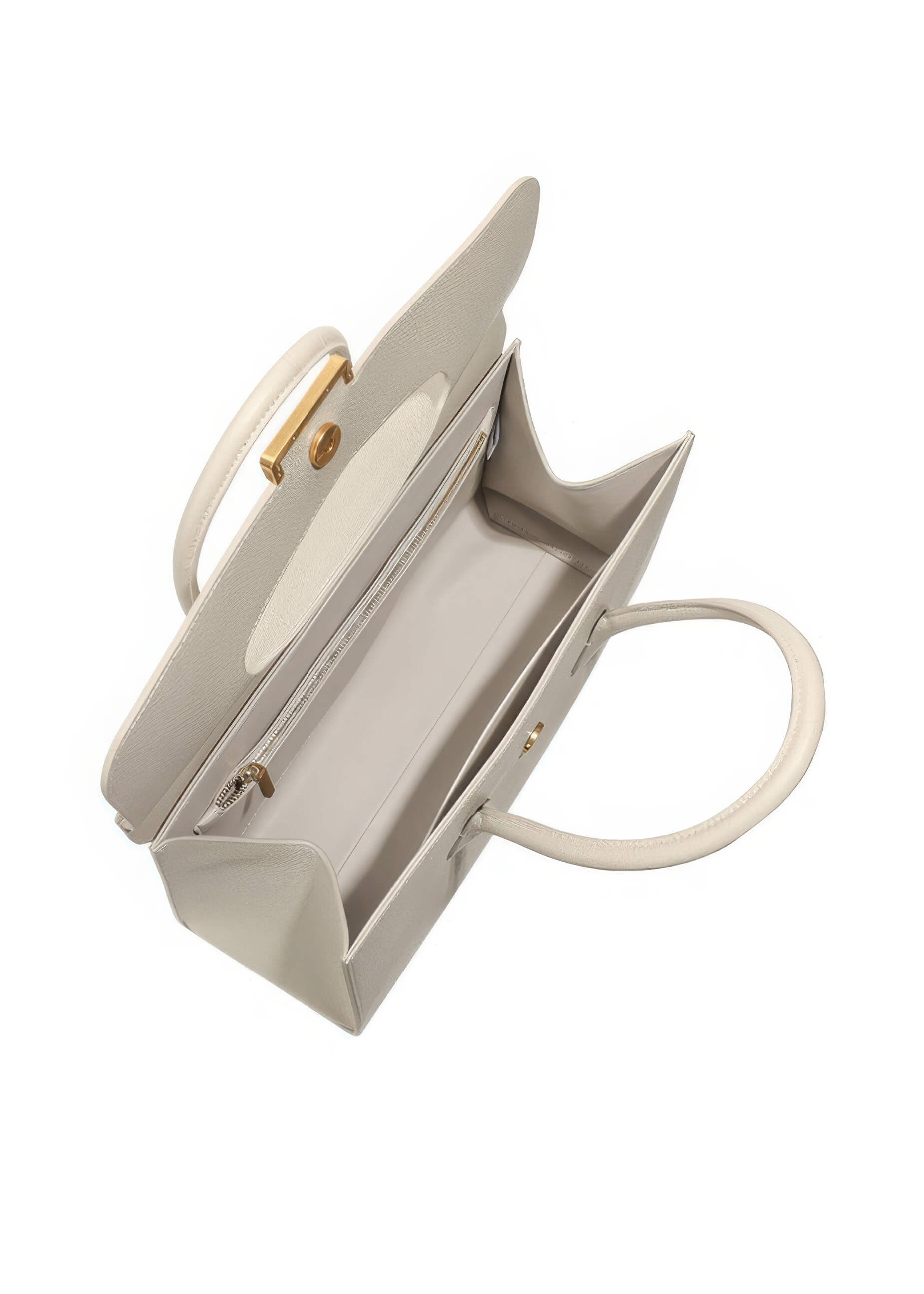 An overhead view of the handbag with the top flap open, revealing a spacious interior with a light-colored lining and a zippered pocket for organization.