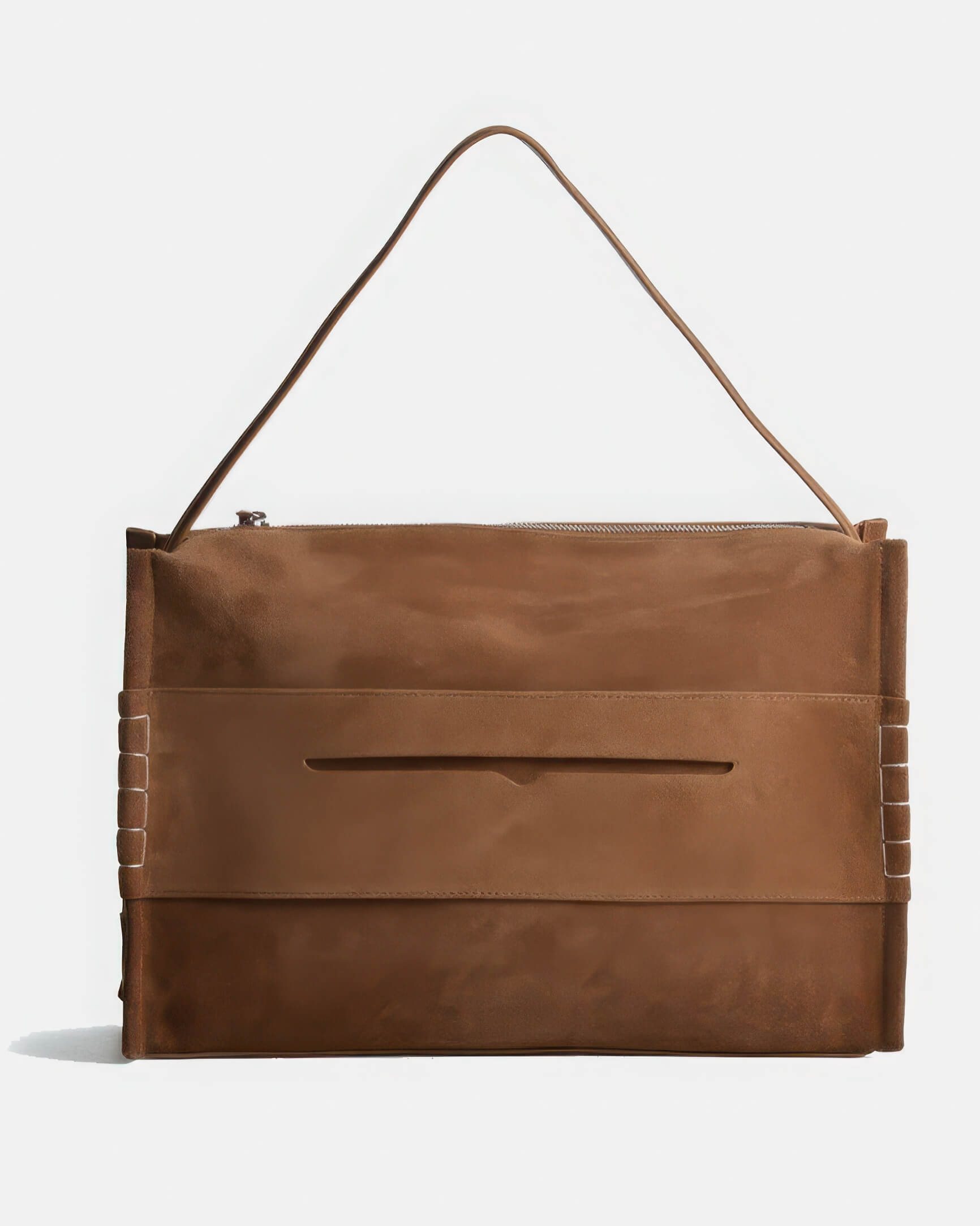 Front studio shot of the women's large suede shoulder bag in brown, featuring a clean minimalist design with a centered slip pocket.