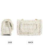 Side and back view of cream woven tweed crossbody bag with braided trim and back slip pocket